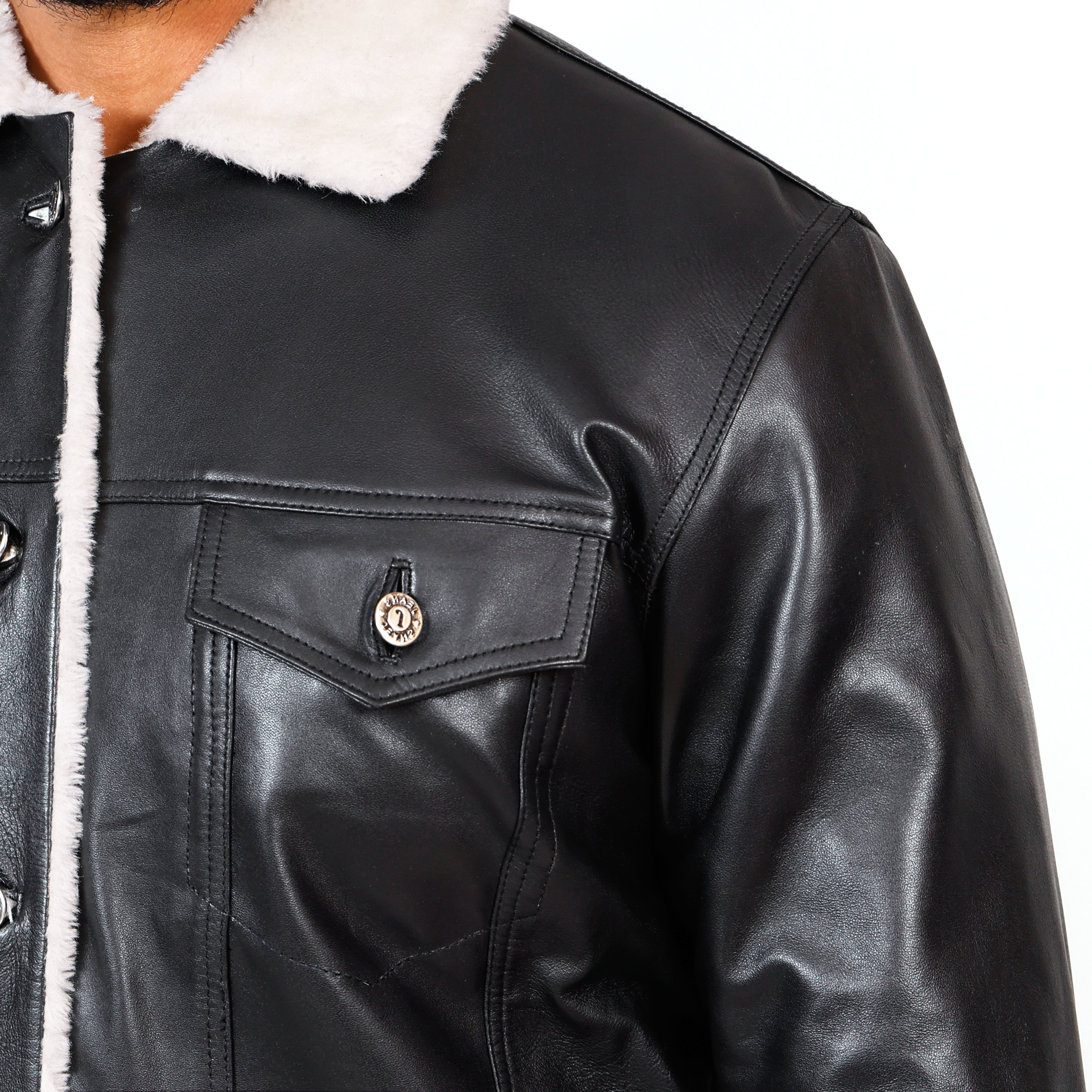 Black leather jacket with white fur lining on a white background