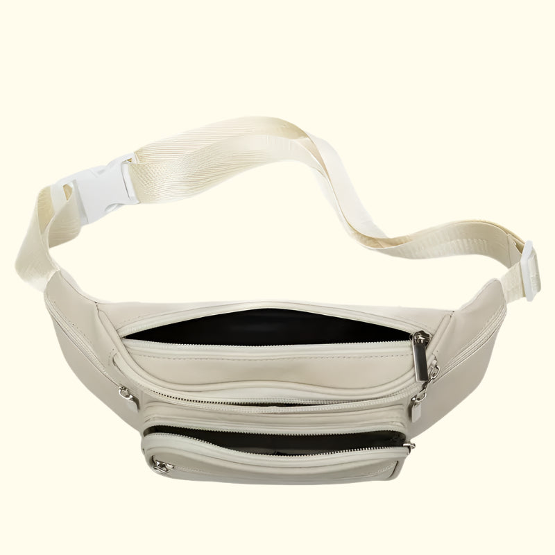 Beige waist bag with multiple zippers on a white background