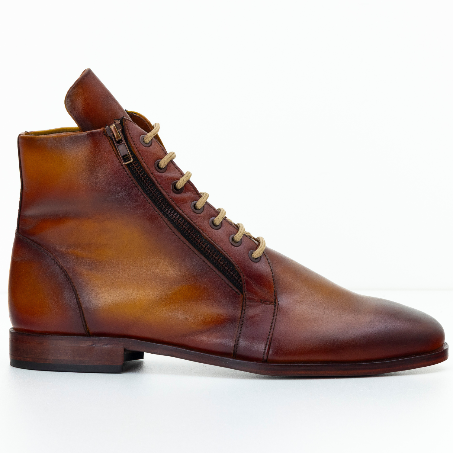 Brown leather boot with a zipper on a white background