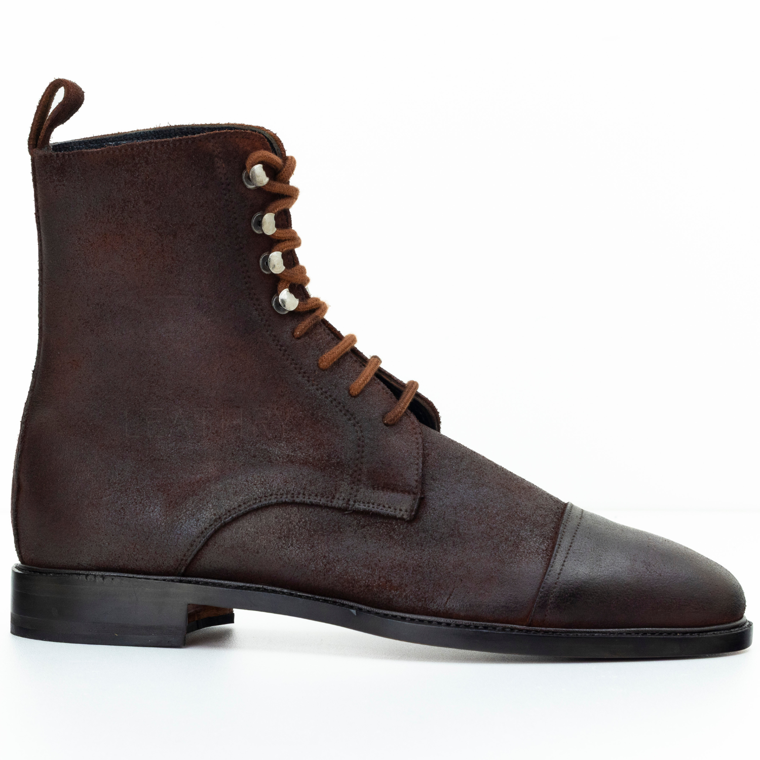 Brown leather boot with laces on a white background