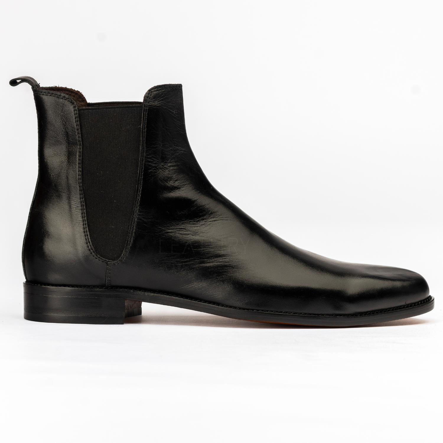 Black leather Chelsea boot on a white background