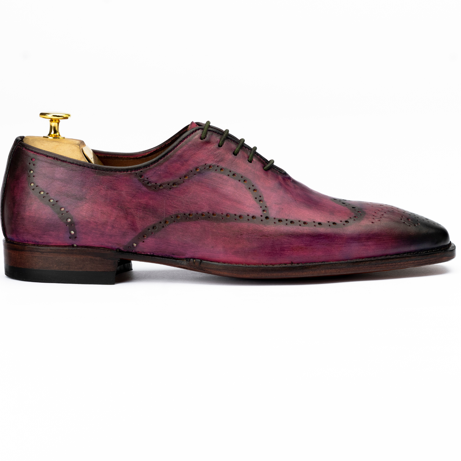Purple leather dress shoe with gold trim on a white background