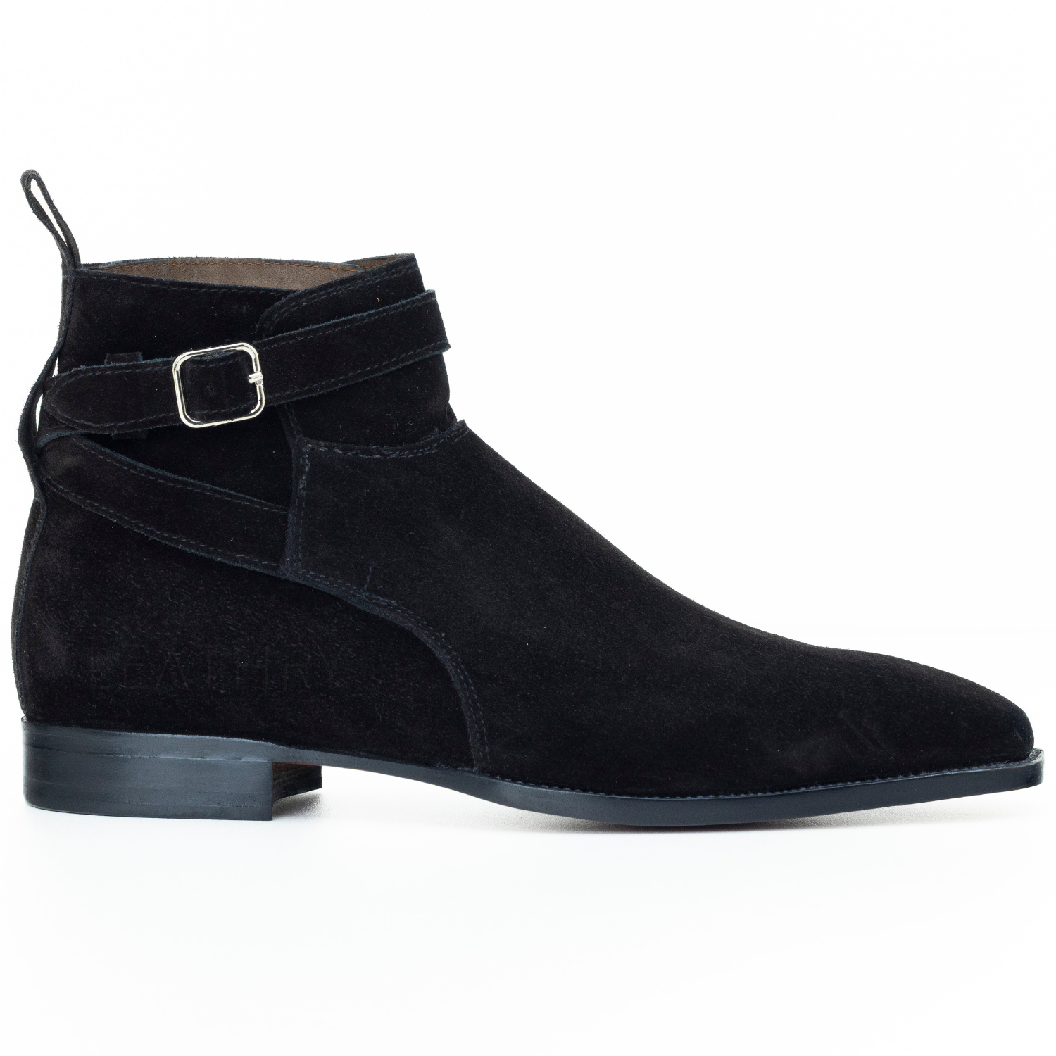 Black suede ankle boot with a buckle on a white background