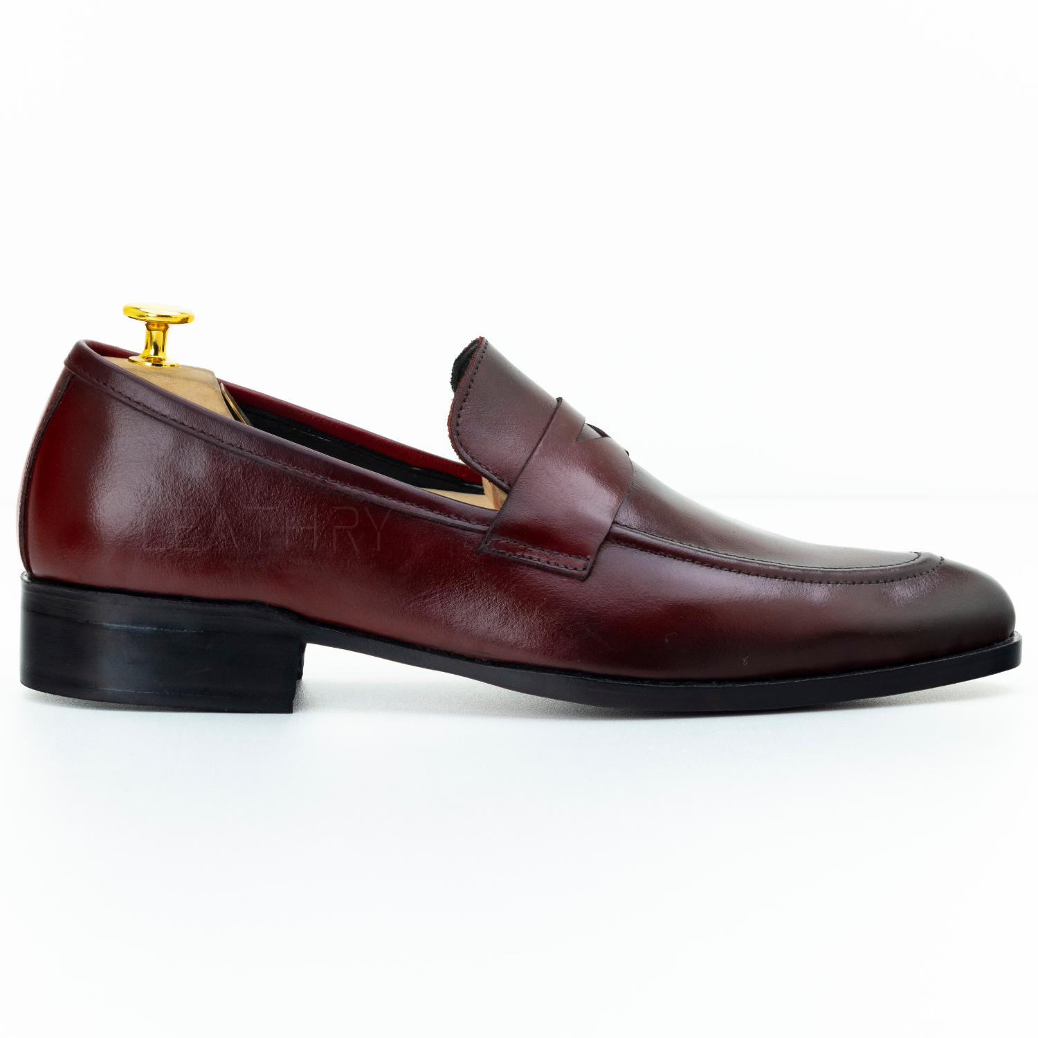 Brown leather loafer shoe on a white background