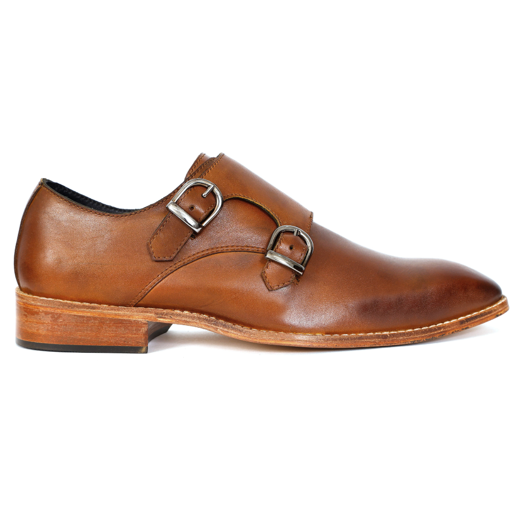 Brown leather shoe with double buckle on a white background