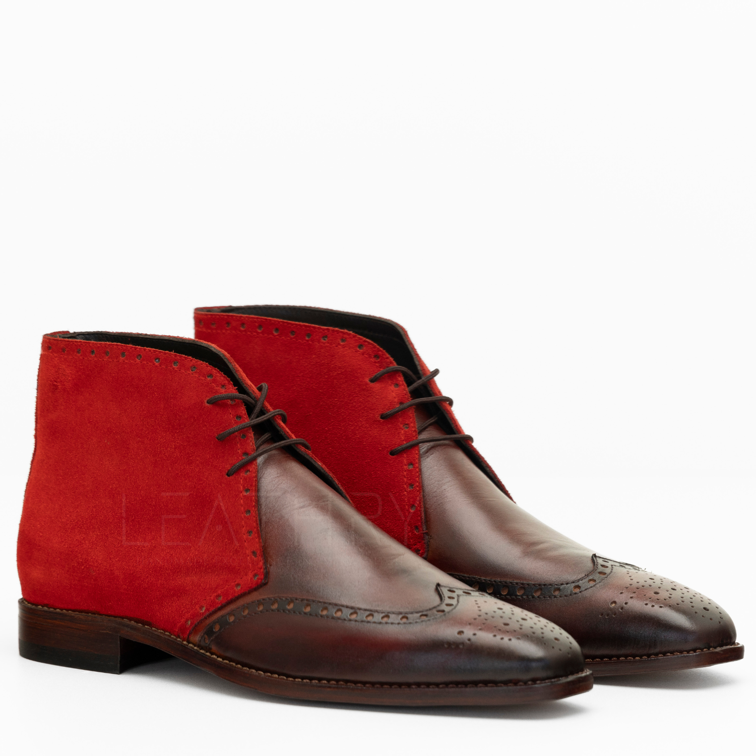 Red and brown dress shoes on a white background