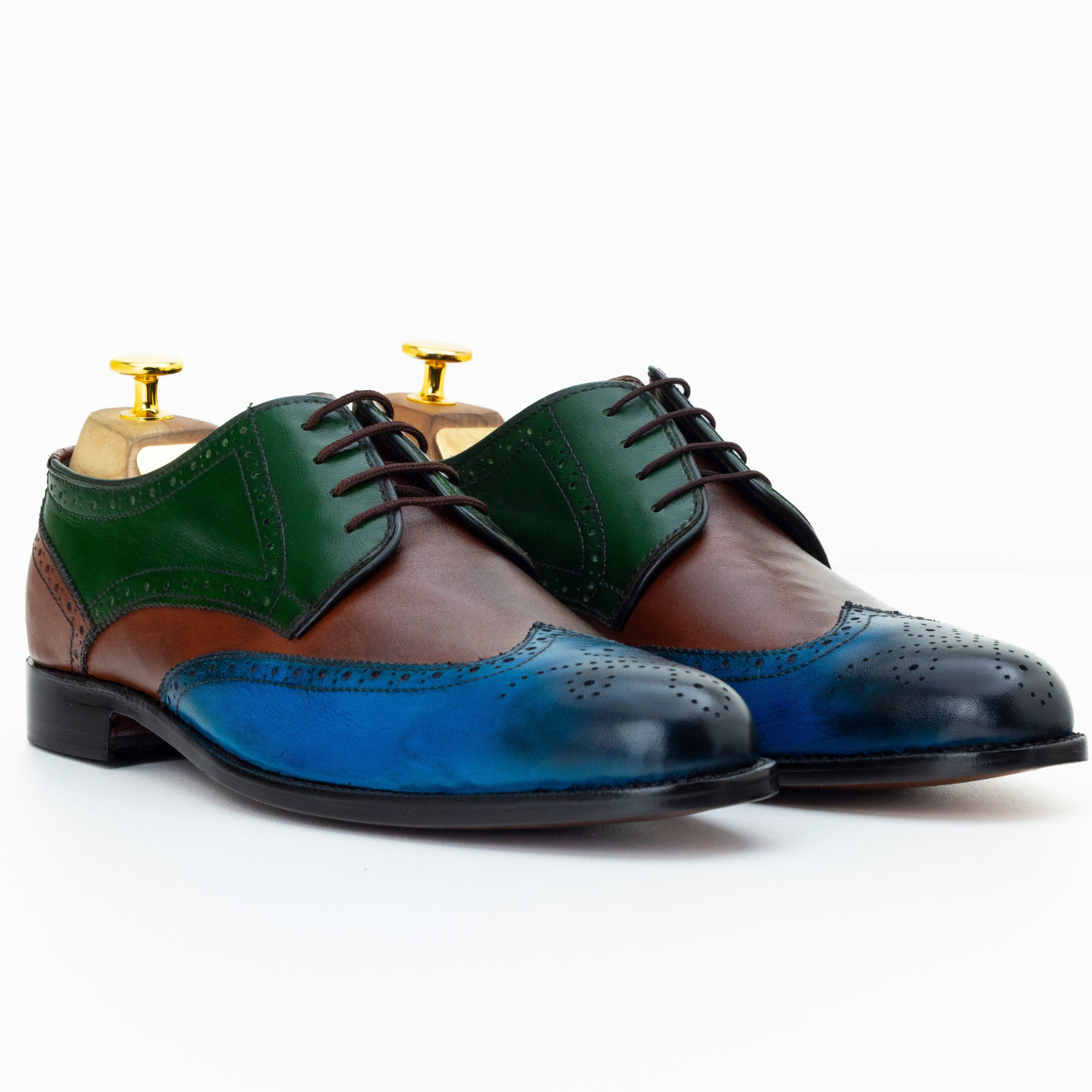Multicolored dress shoes on a white background