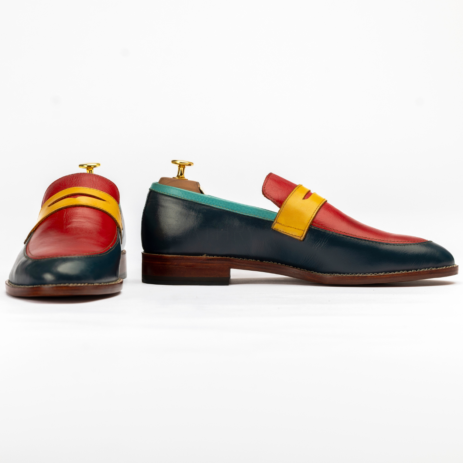 Colorful loafers with a multicolor strap on a white background