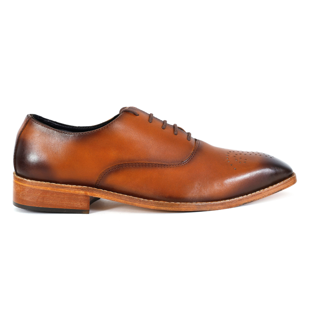 Brown leather dress shoe on a white background