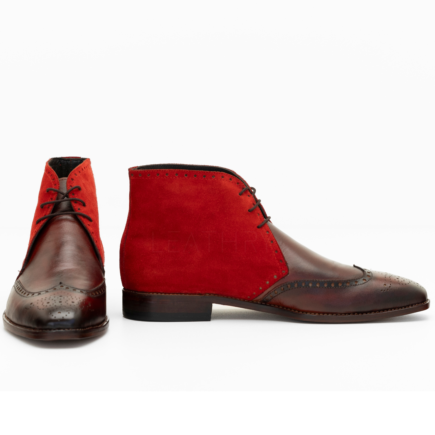 Red and brown leather boots on a white background