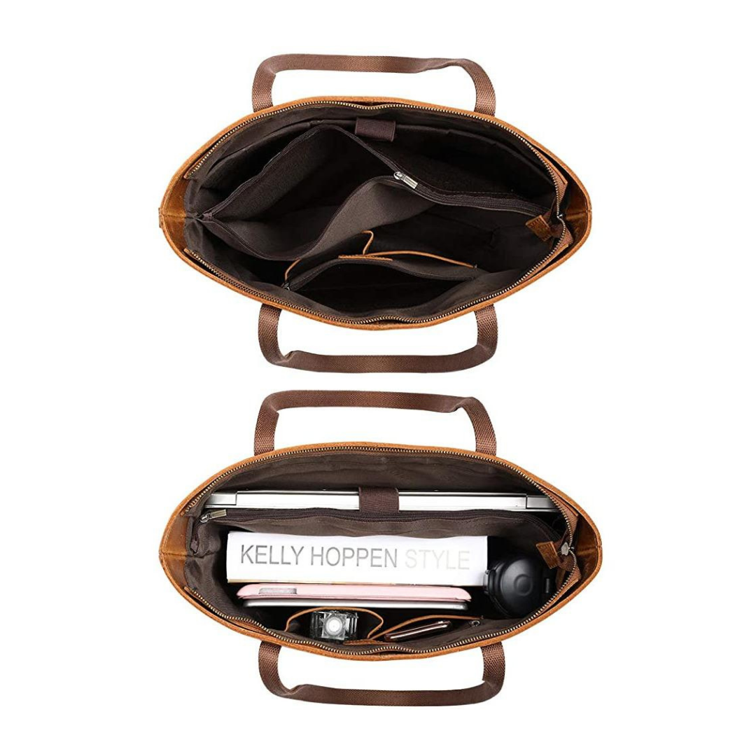 Brown leather bag with interior compartments on a white background