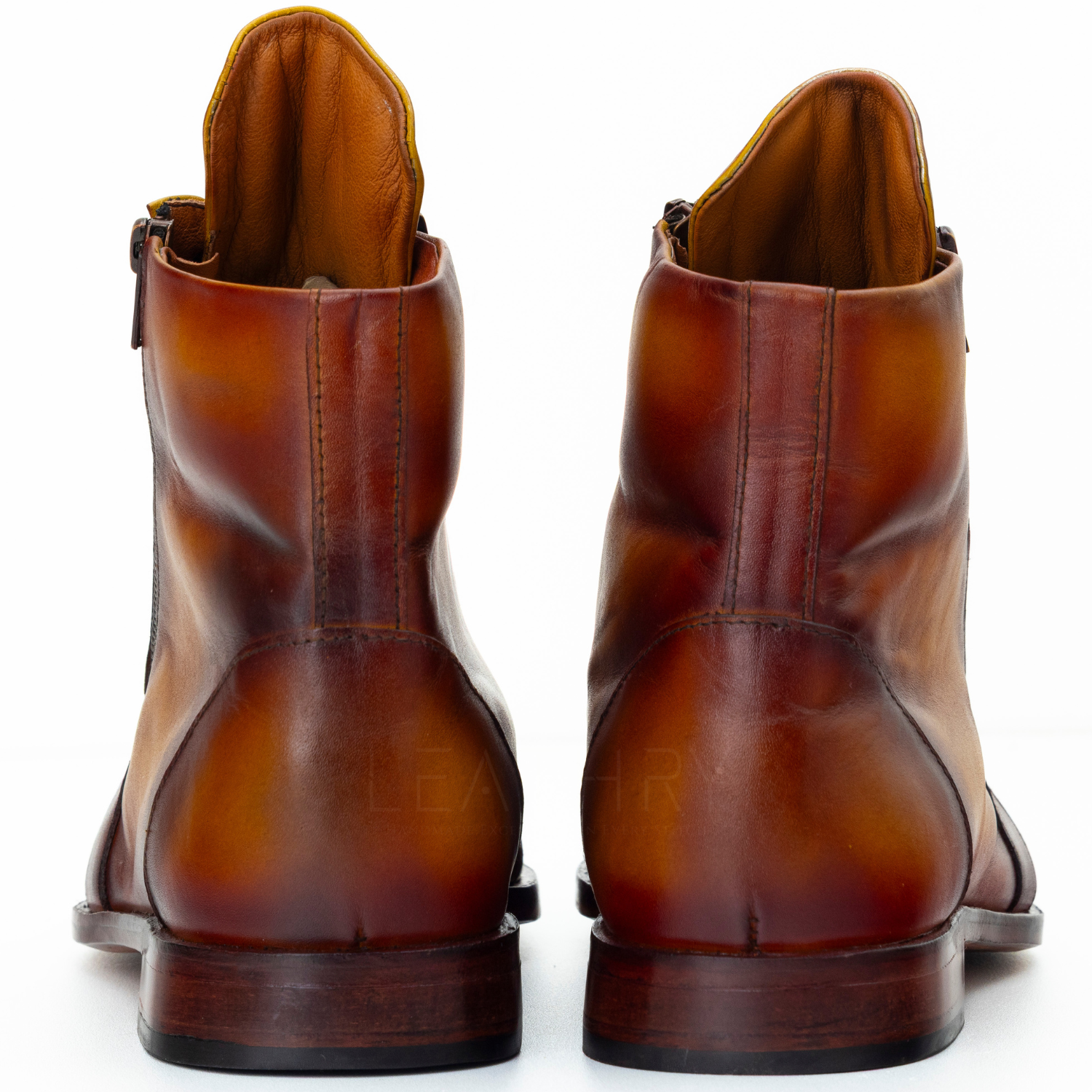 Brown leather boots on a white background