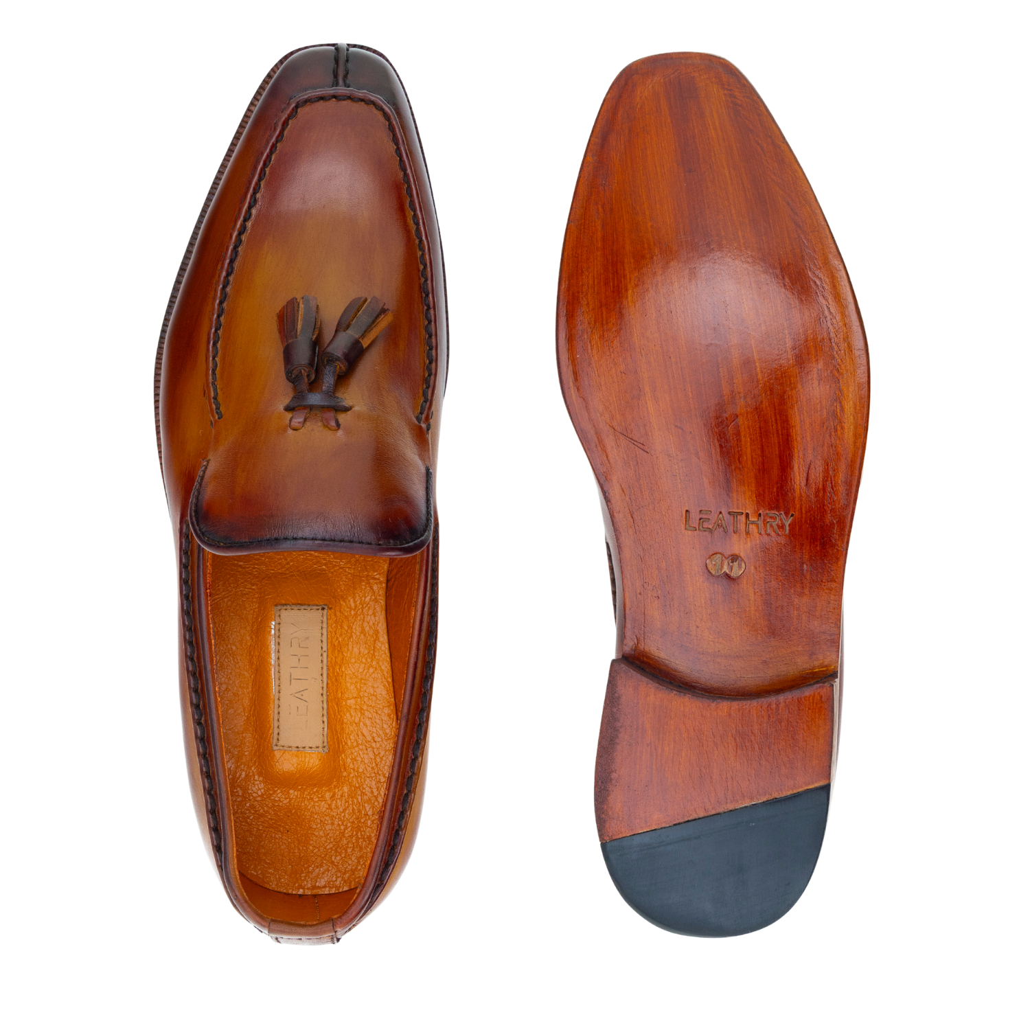 Brown leather shoes with tassel on a white background