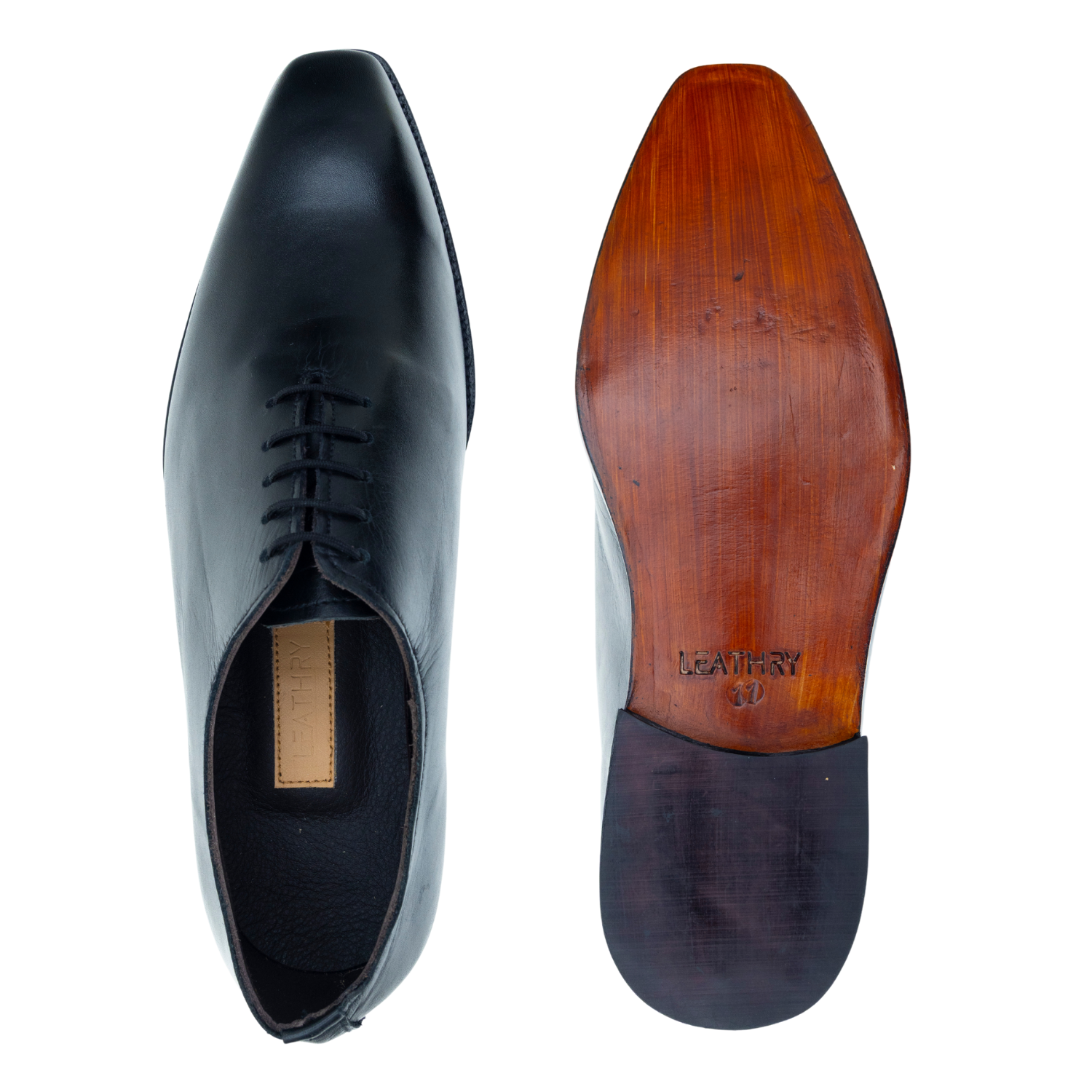 Black dress shoe with wooden sole on a white background