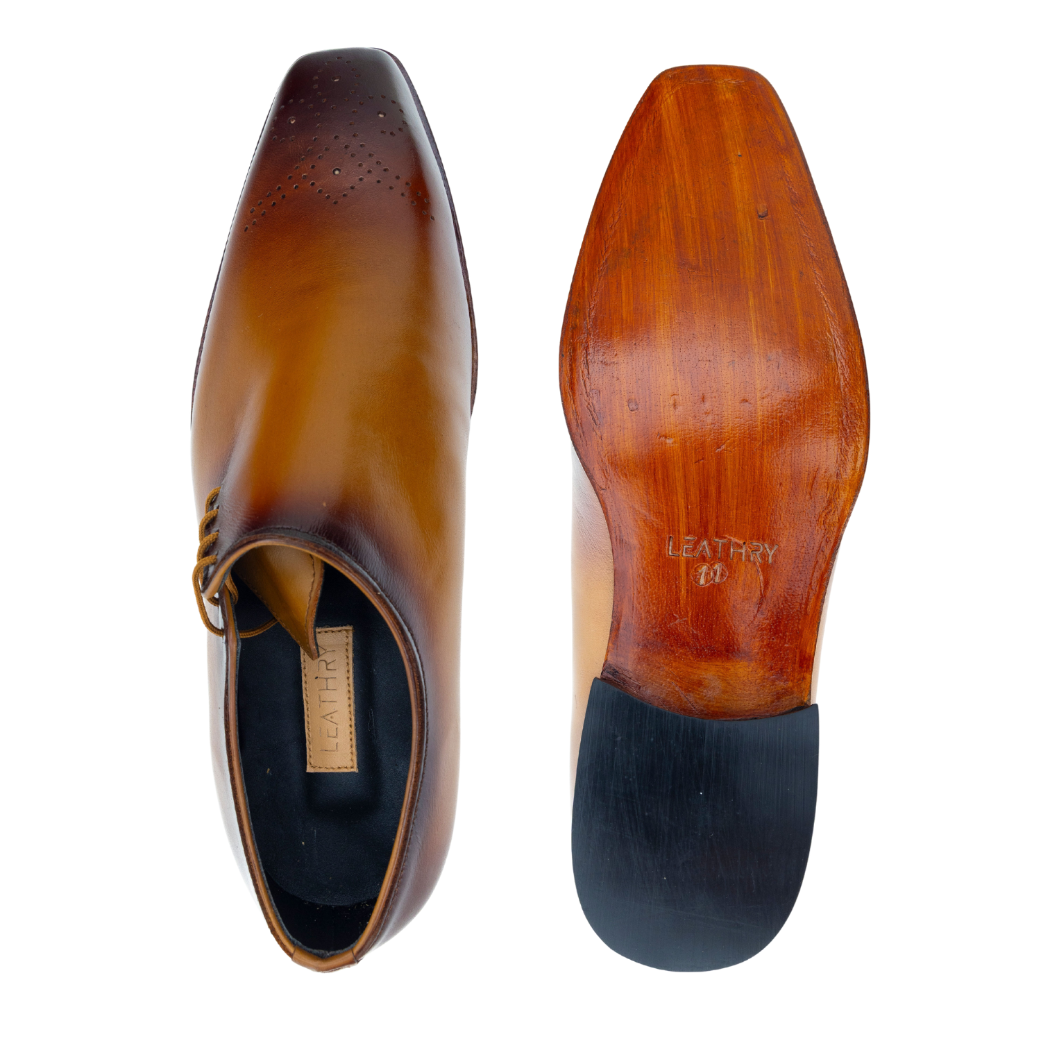 Brown leather shoe with sole showing brand name on a white background