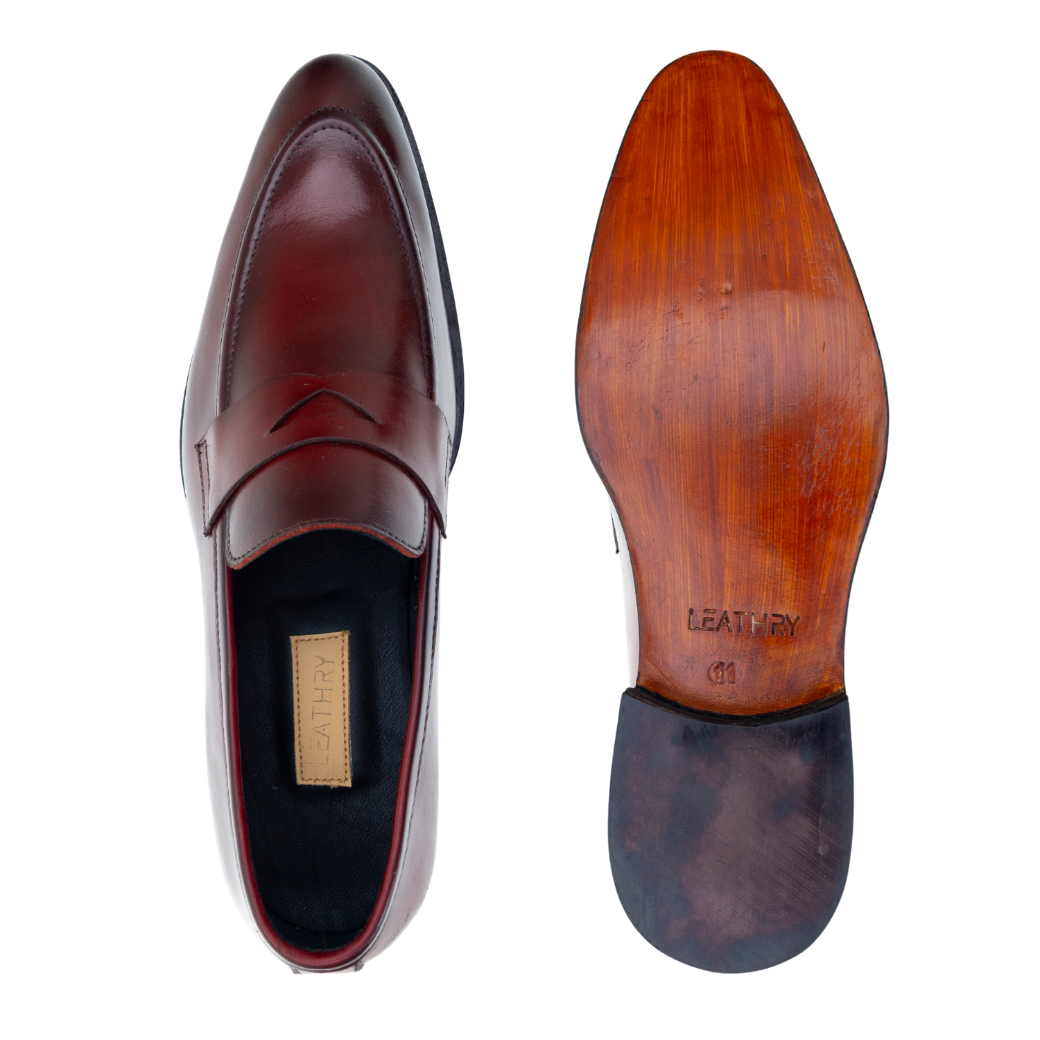 Brown leather loafer shoe with a focus on the sole and brand name 'Leather' on a white background.