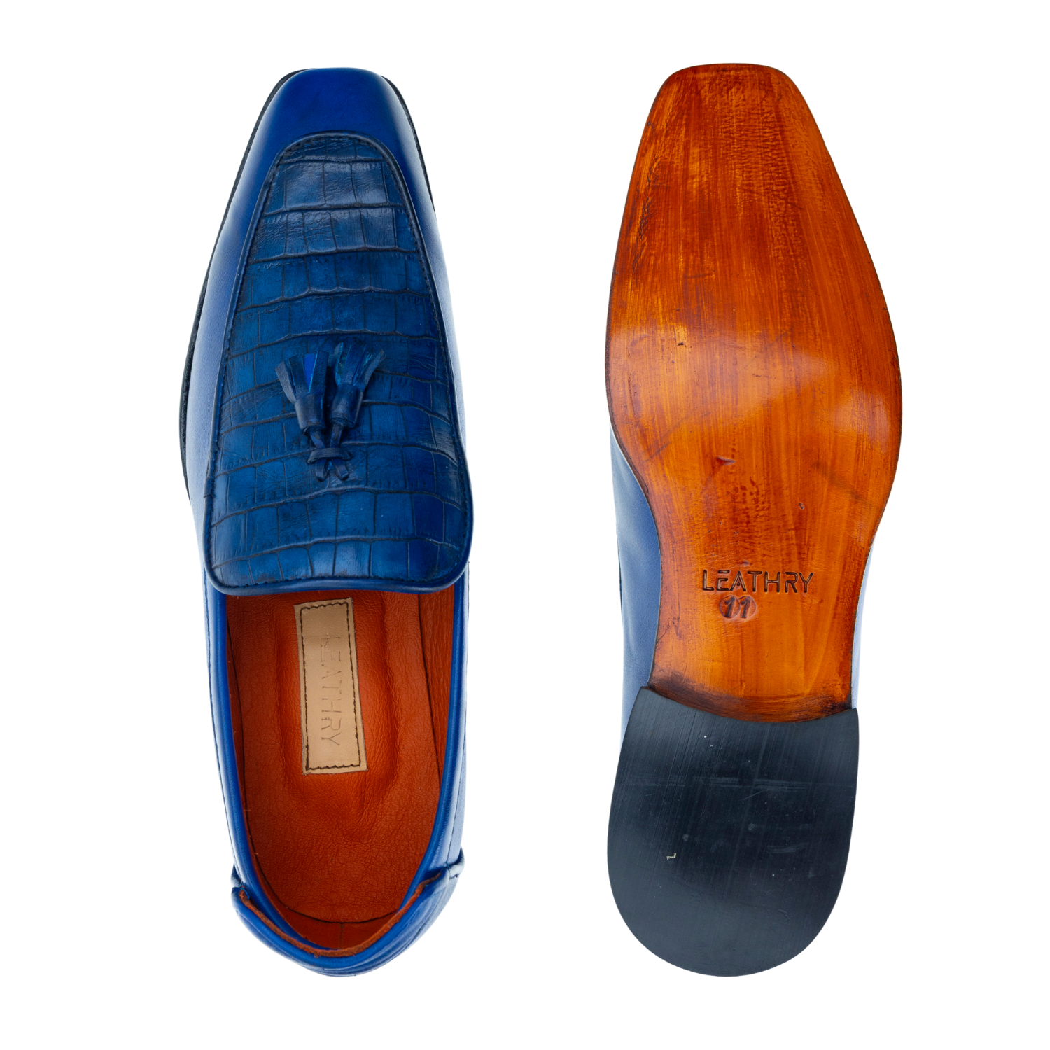 Blue leather loafer with wooden sole on a white background