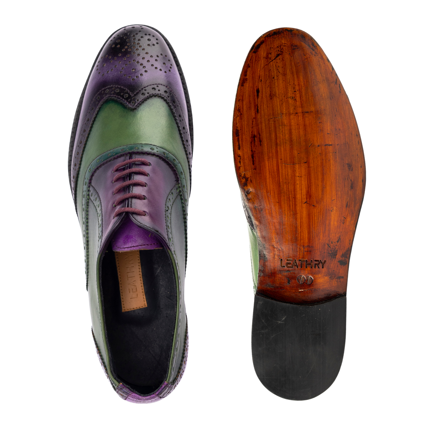 Purple and green leather shoe with wooden sole on a white background