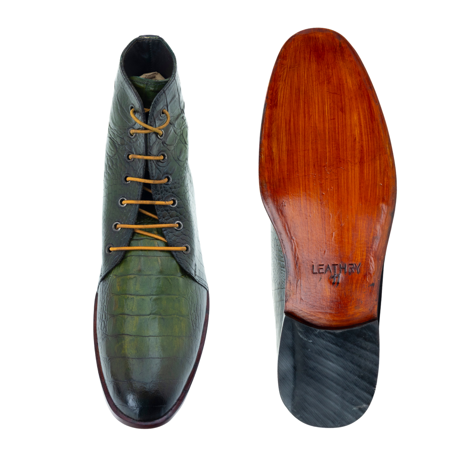 Green leather shoe with brown sole on a white background