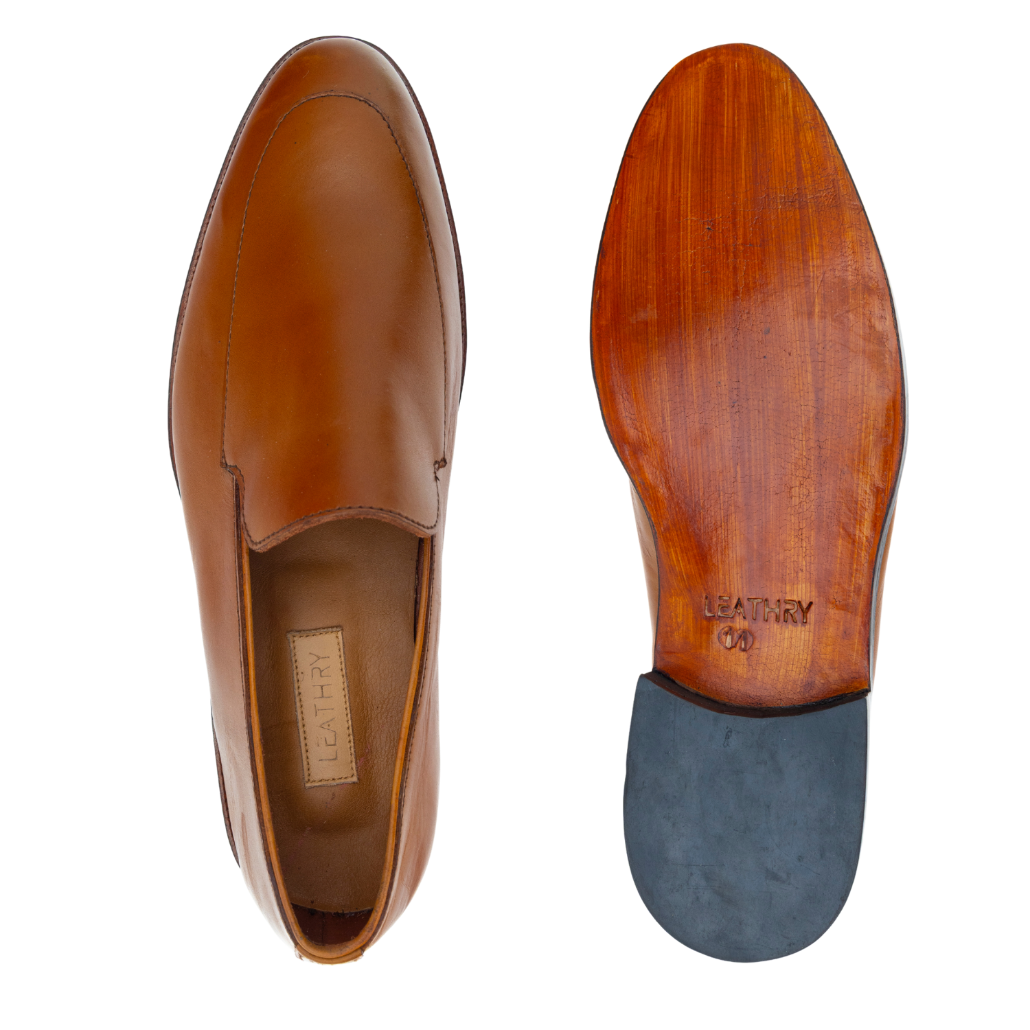 Brown leather loafer shoe with wooden sole on a white background