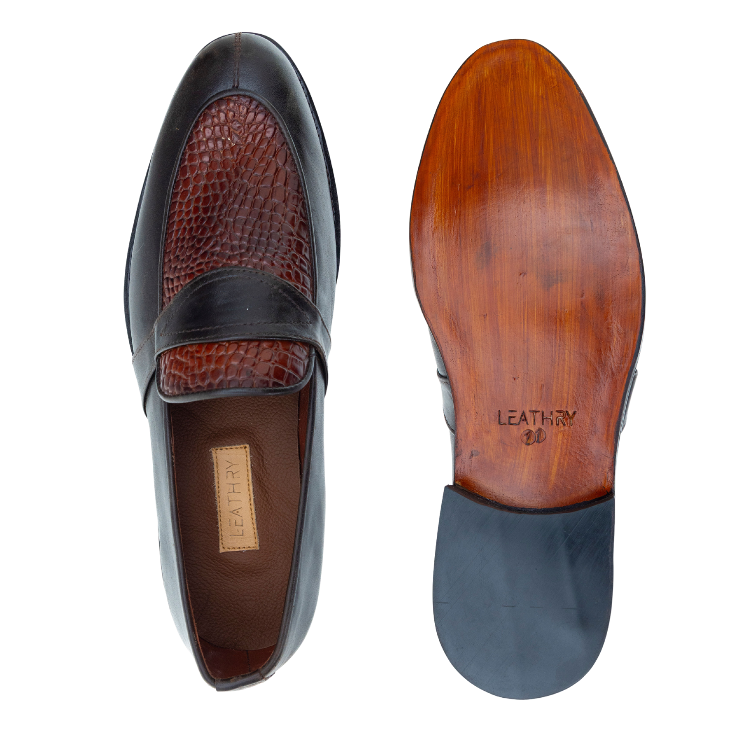 Pair of leather loafers with a focus on the sole and texture details.