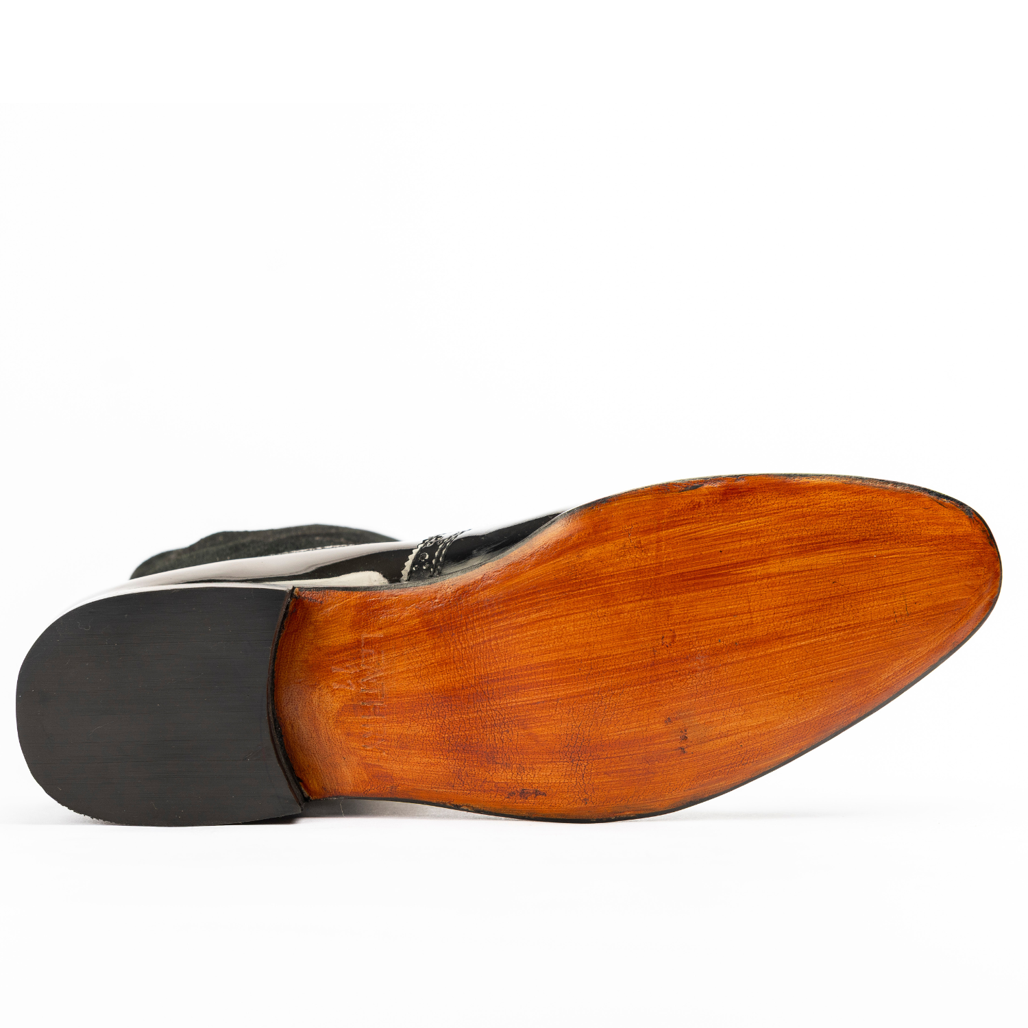 Close-up of a shoe sole with wooden finish on a white background