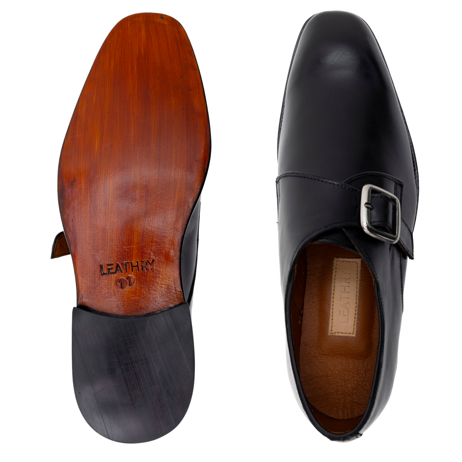 Black leather dress shoe with a buckle on a white background