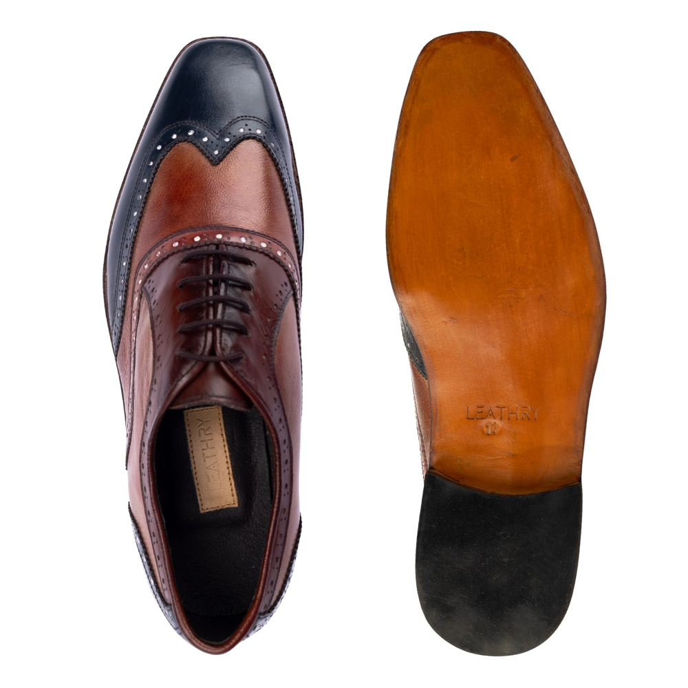 Brown leather dress shoe with black sole on a white background