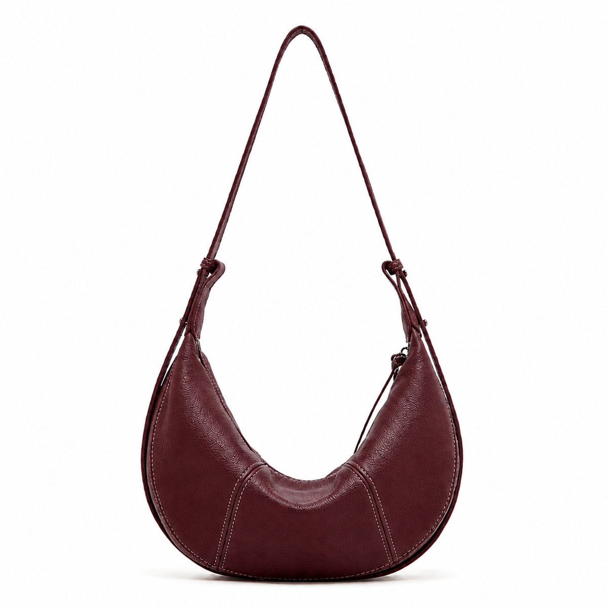 A crescent-shaped shoulder bag in dark burgundy leather with a single adjustable strap, shown against a plain white background.