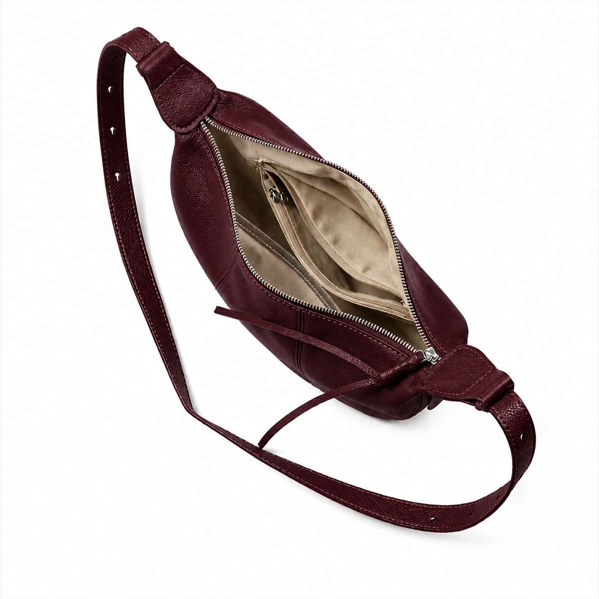 A burgundy leather crossbody bag with an open zipper revealing a beige interior lining, shown on a clean white background.