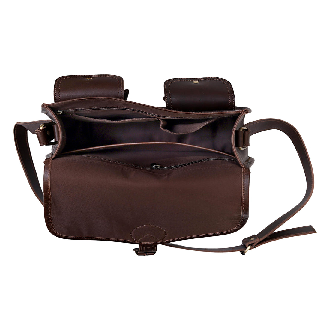 Brown leather bag with a shoulder strap on a white background