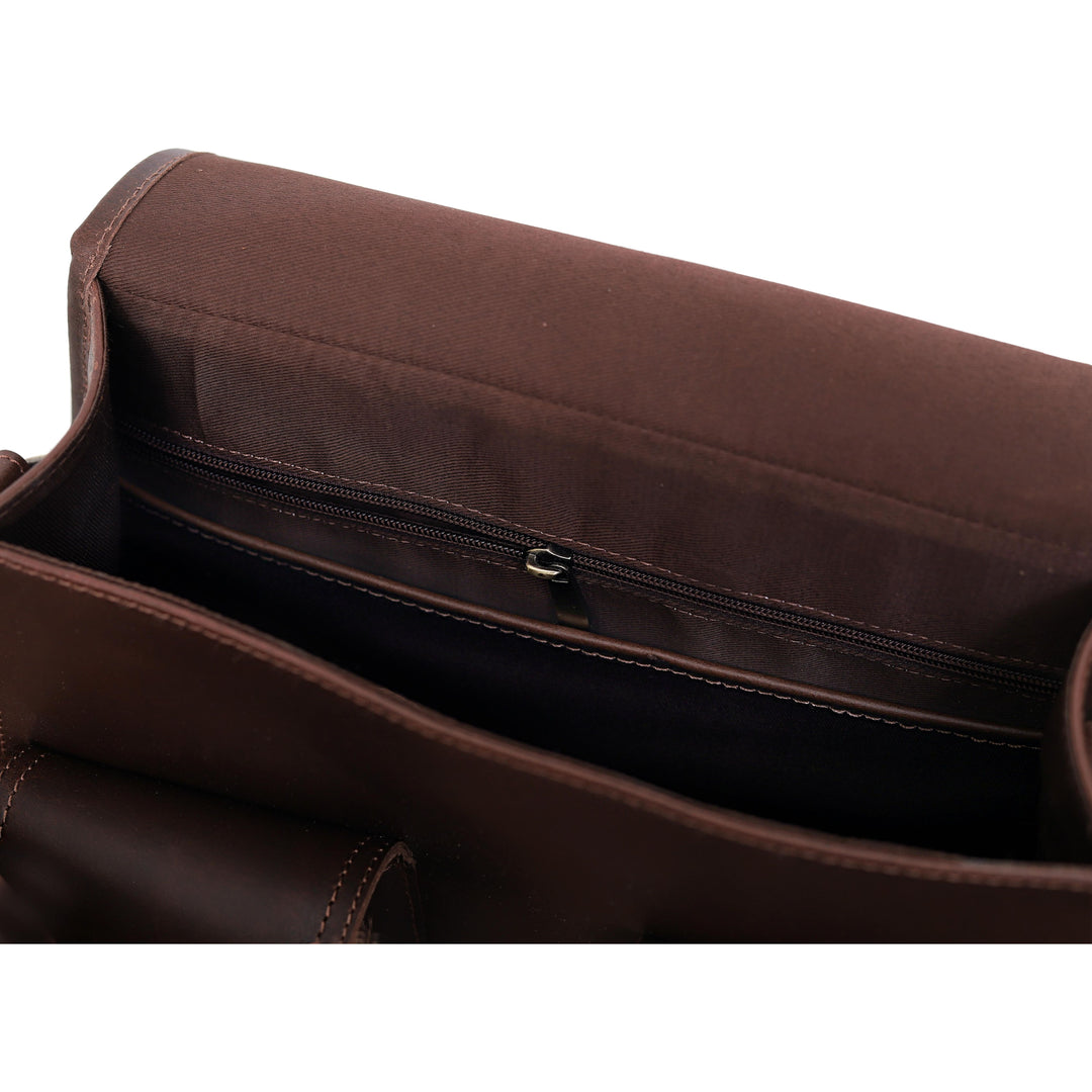 Brown leather bag with a visible zipper on a white background