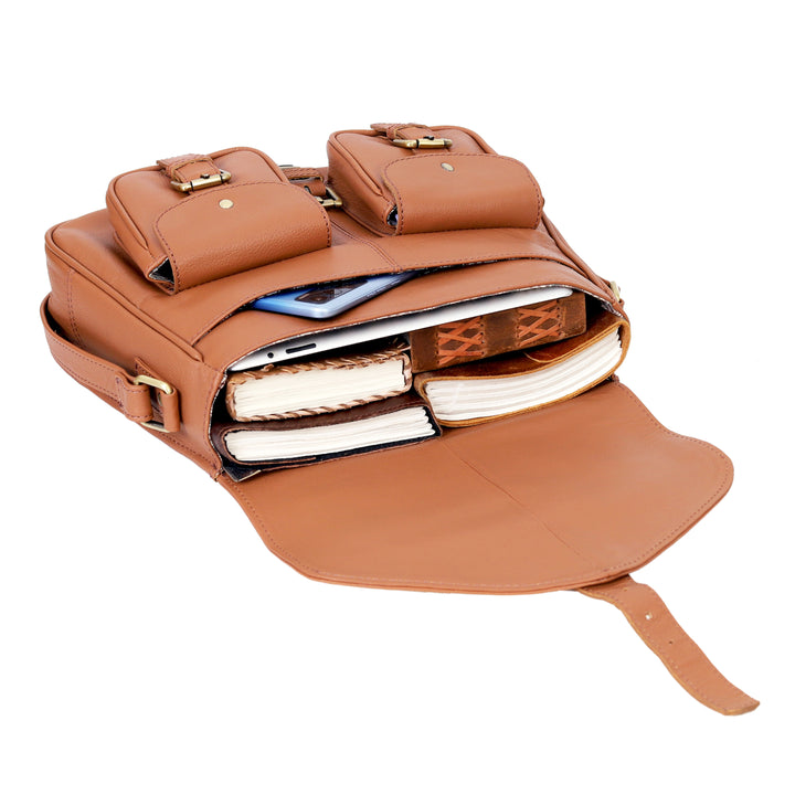 Brown leather backpack with compartments and a phone inside on a white background