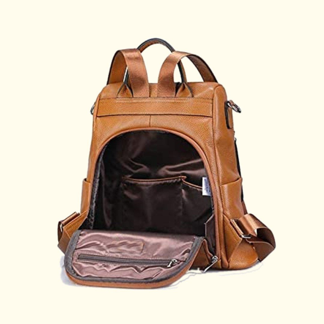 Brown leather backpack with open front pocket on a white background