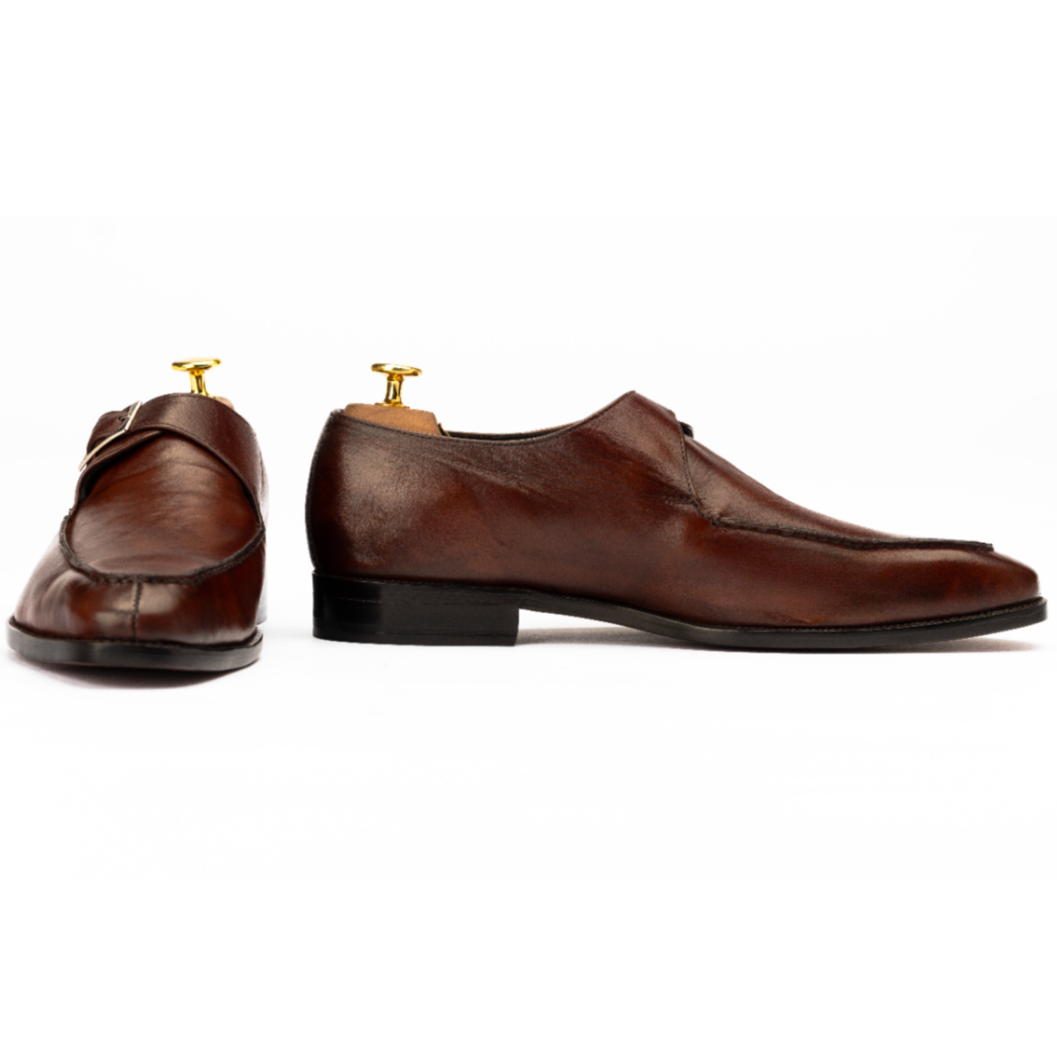 Pair of brown dress shoes on a white background