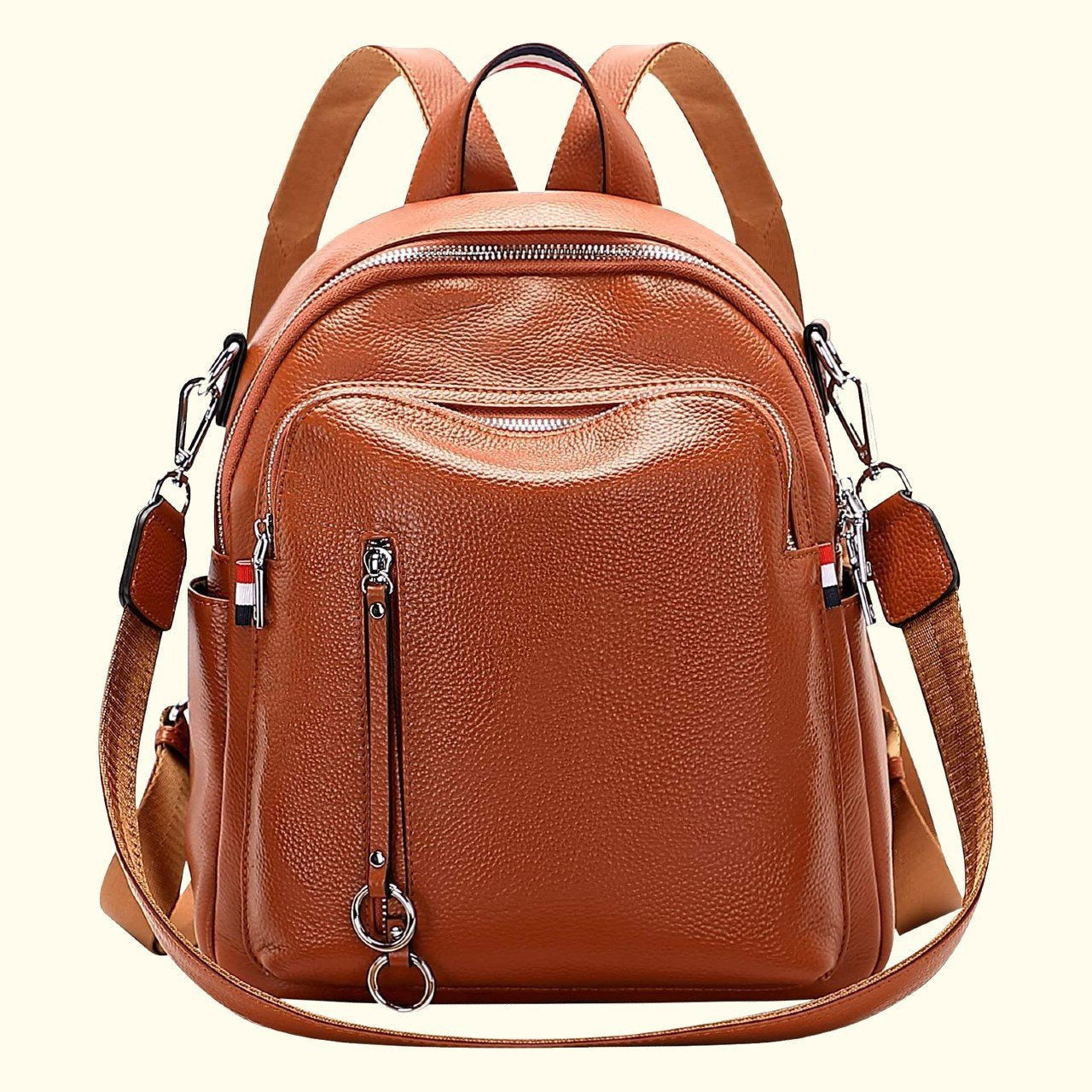 Brown leather backpack with multiple pockets and straps on a white background