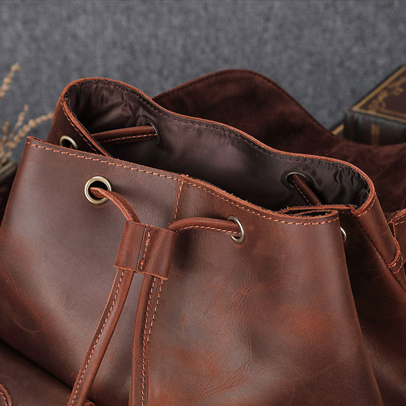 Close-up of a brown leather bag with a textured background