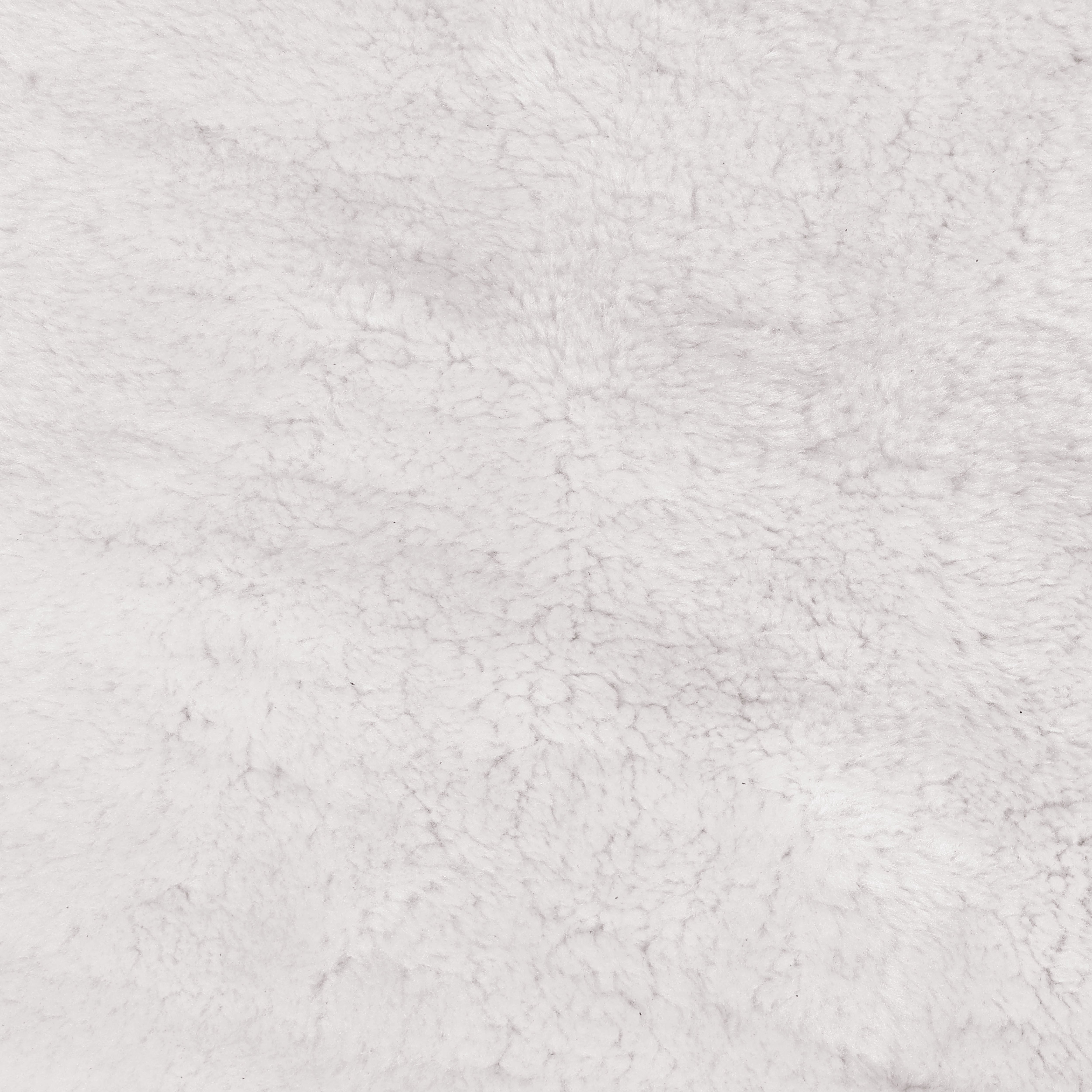Close-up of a textured white fabric surface