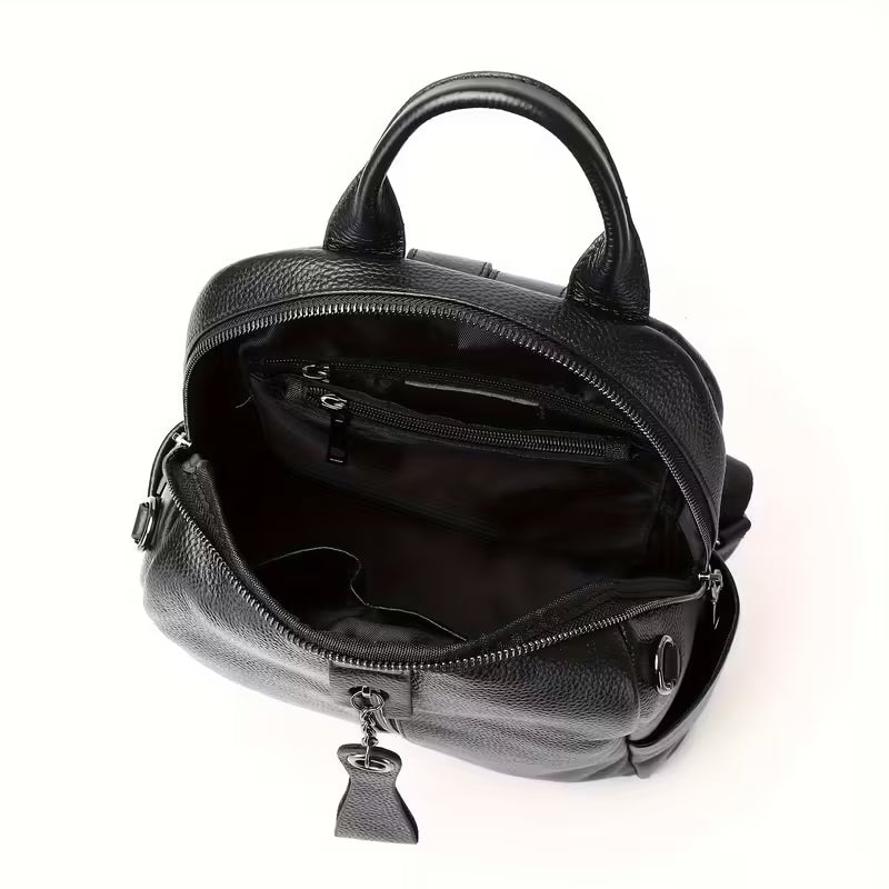 Black leather backpack with open front compartment on a white background