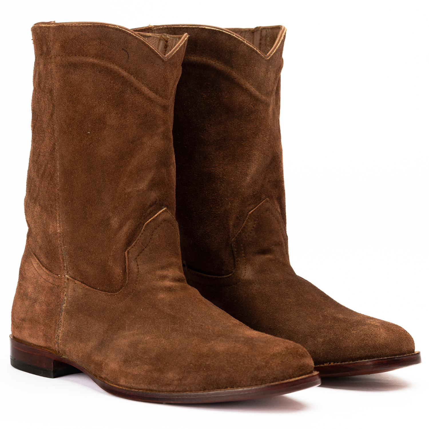 Pair of brown suede boots on a white background