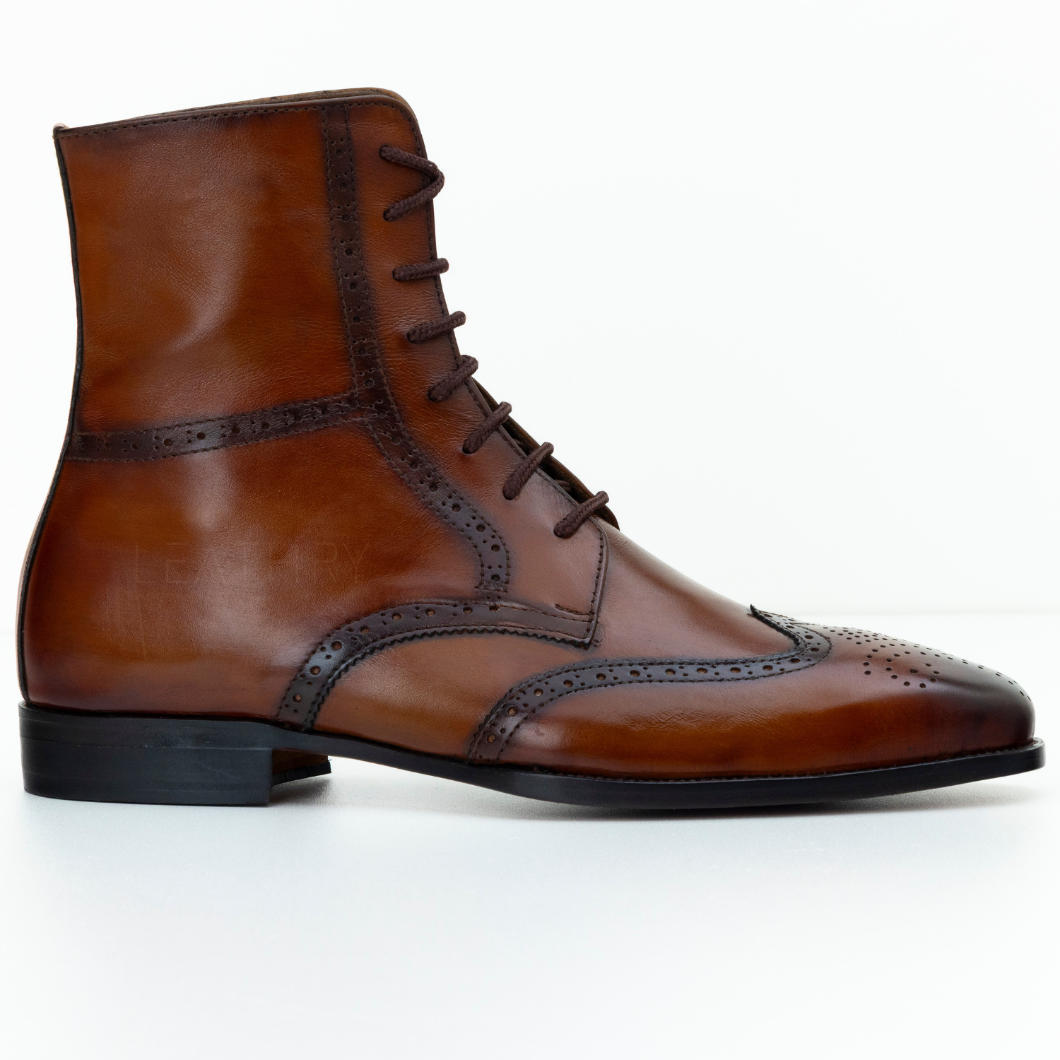 Brown leather dress boot on a white background