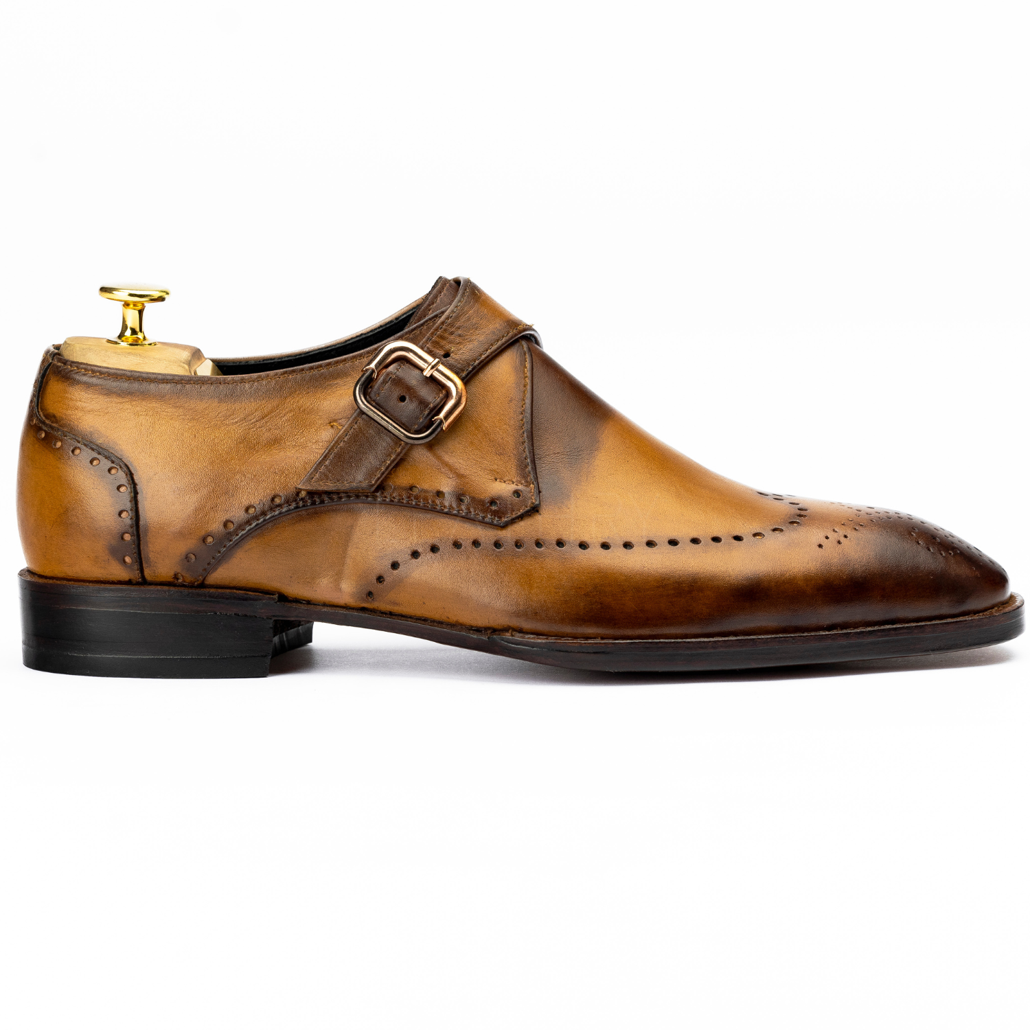 Brown leather dress shoe with a gold buckle on a white background