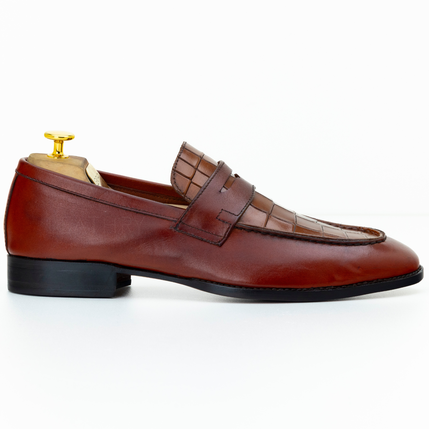 Brown leather loafer shoe on a white background