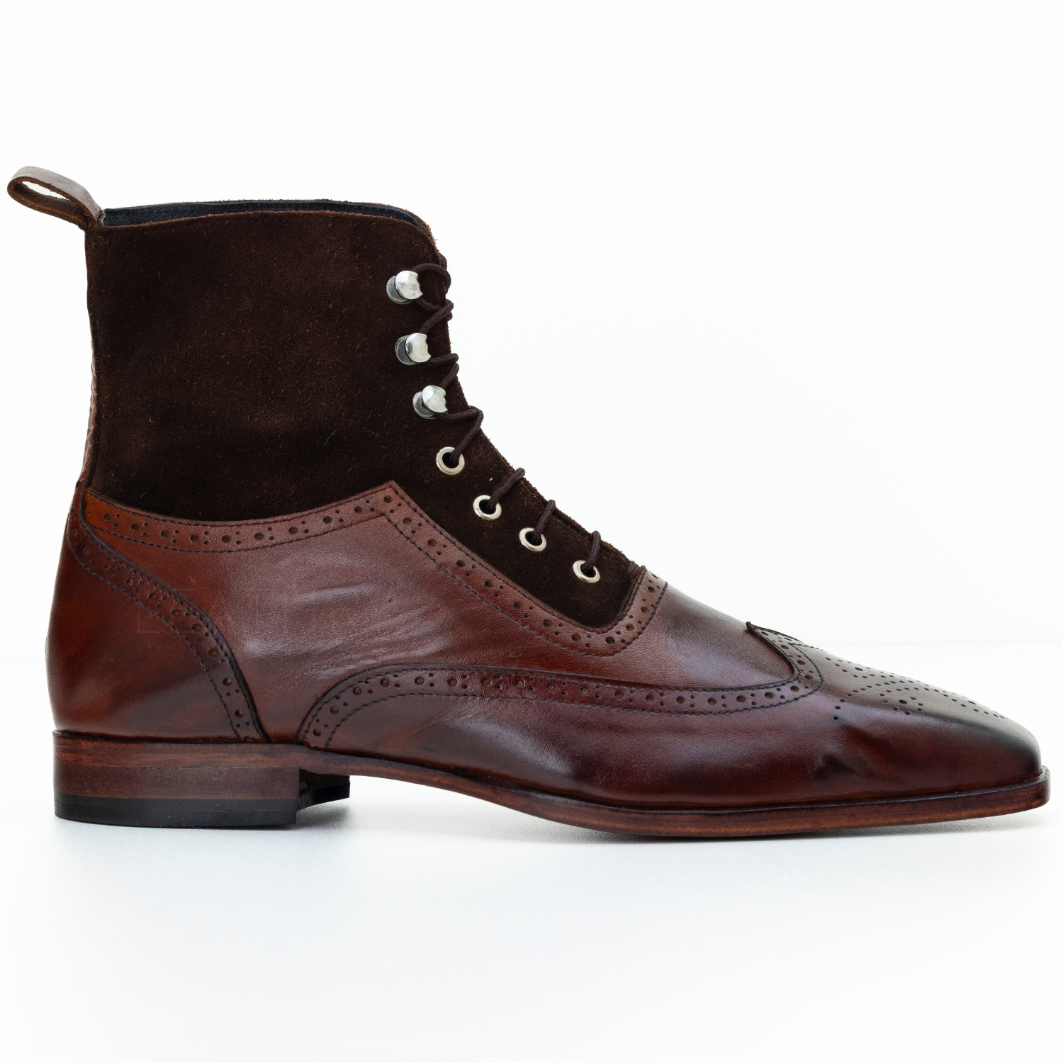 Brown leather boot with lace-up design on a white background