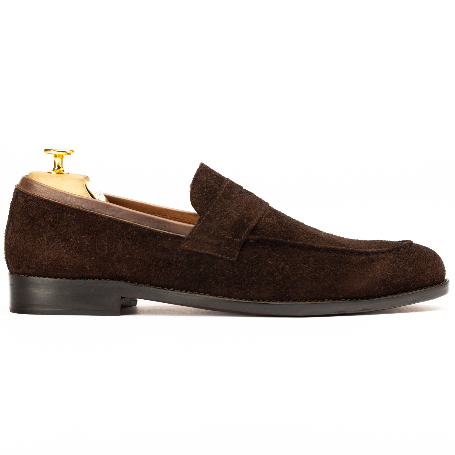 Brown suede loafer on a white background