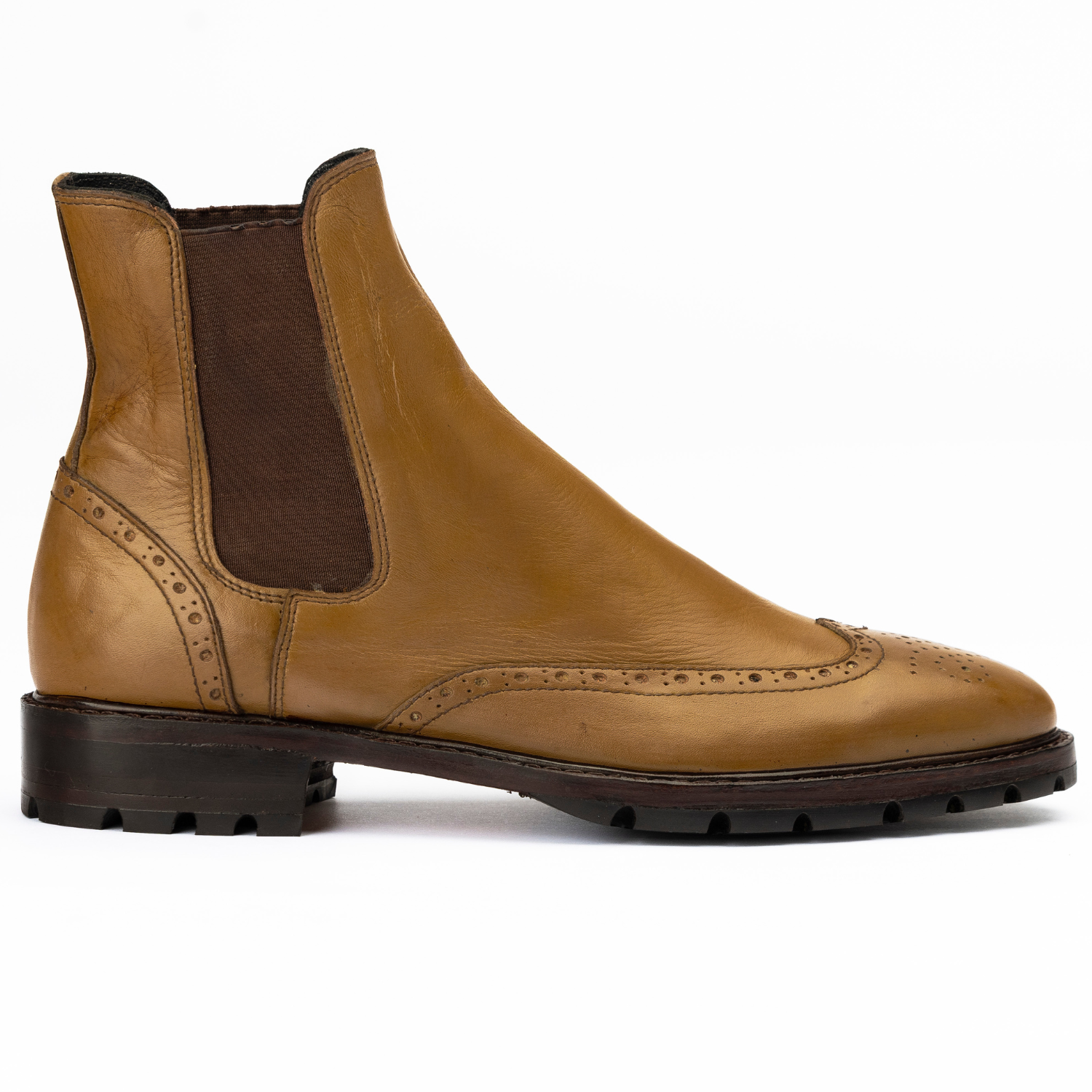 Brown leather Chelsea boot on a white background