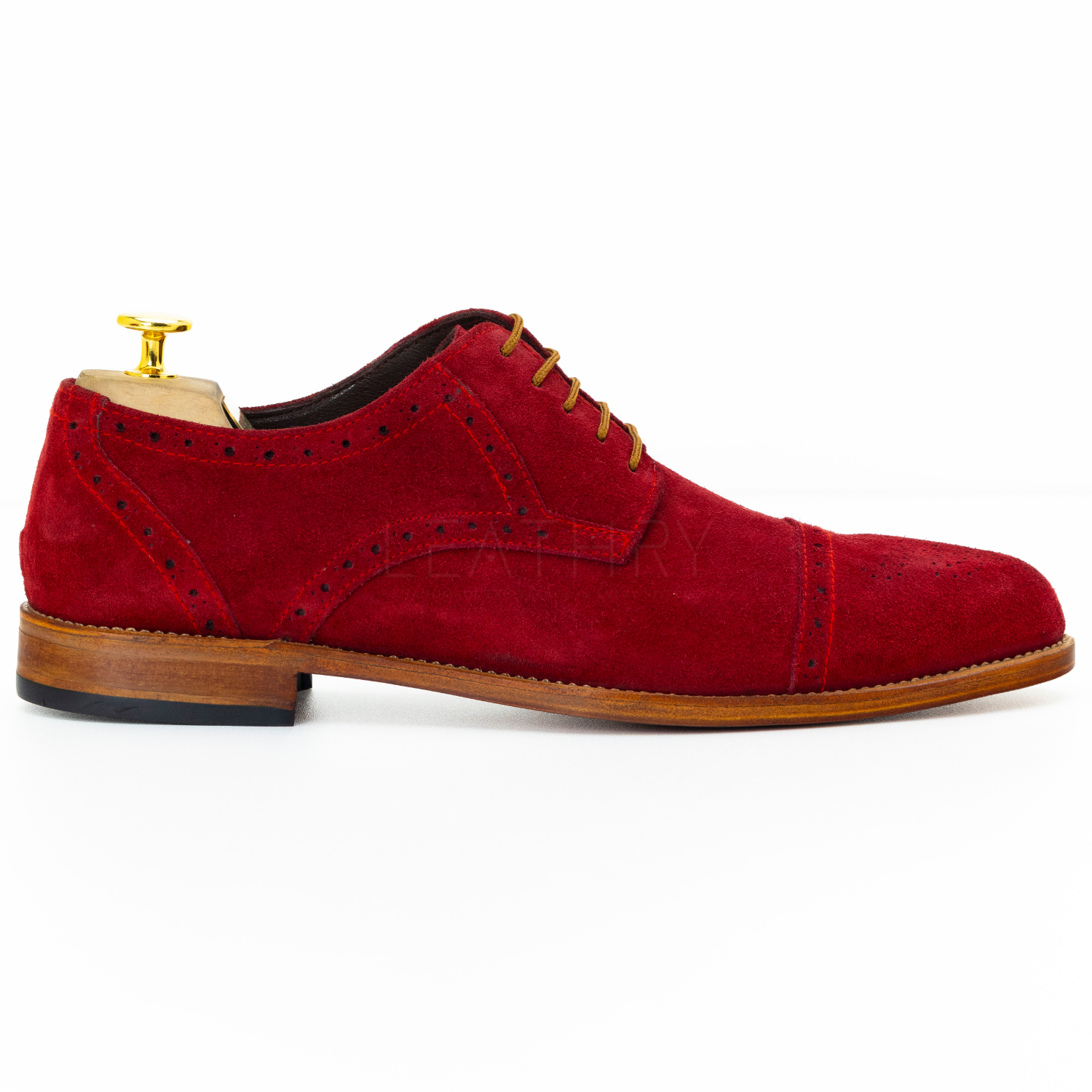 Red suede dress shoe on a white background