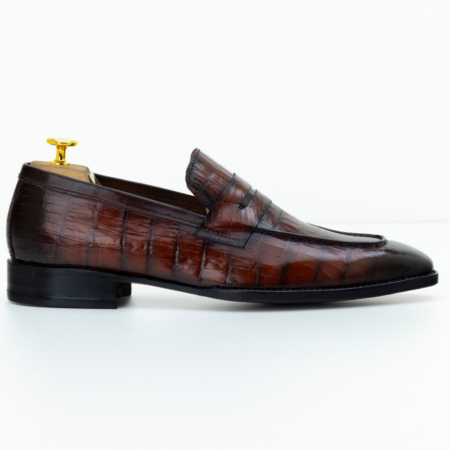 Brown leather loafer shoe on a white background
