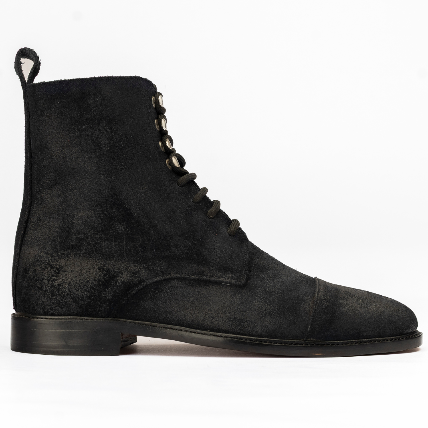 Black suede lace-up boot on a white background