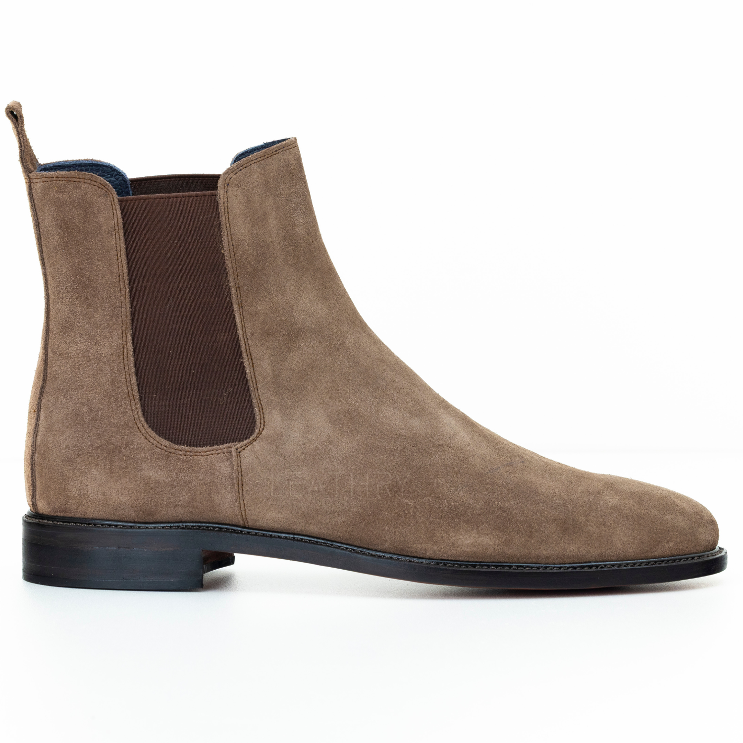 Brown suede Chelsea boot on a white background